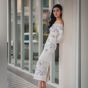 White and purple floral dress with an off the shoulder neckline.